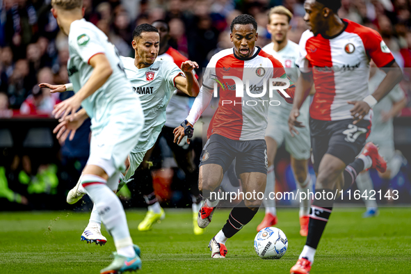 FC Twente defender Anass Salah-Eddine and Feyenoord Rotterdam midfielder Quinten Timber play during the match between Feyenoord and Twente a...