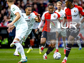 FC Twente defender Anass Salah-Eddine and Feyenoord Rotterdam midfielder Quinten Timber play during the match between Feyenoord and Twente a...