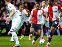 FC Twente defender Anass Salah-Eddine and Feyenoord Rotterdam midfielder Quinten Timber play during the match between Feyenoord and Twente a...