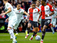 FC Twente defender Anass Salah-Eddine and Feyenoord Rotterdam midfielder Quinten Timber play during the match between Feyenoord and Twente a...