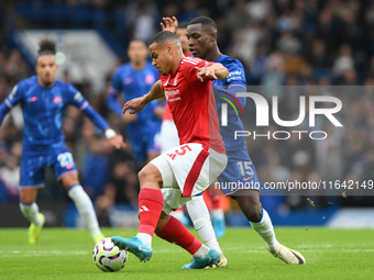 Murillo of Nottingham Forest tackles Nicolas Jackson of Chelsea during the Premier League match between Chelsea and Nottingham Forest at Sta...