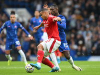 Murillo of Nottingham Forest tackles Nicolas Jackson of Chelsea during the Premier League match between Chelsea and Nottingham Forest at Sta...