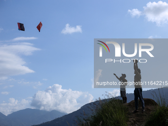 Nepalese people fly kites in the open space in Kathmandu, Nepal, on October 5, 2024. (