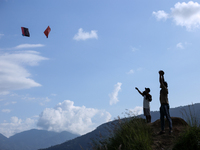 Nepalese people fly kites in the open space in Kathmandu, Nepal, on October 5, 2024. (