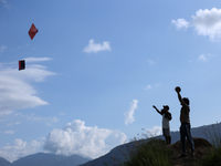 Nepalese people fly kites in the open space in Kathmandu, Nepal, on October 5, 2024. (