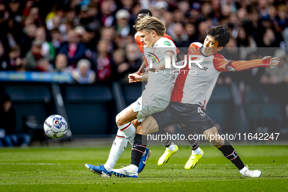 FC Twente midfielder Sem Steijn and Feyenoord Rotterdam midfielder Inbeom Hwang play during the match between Feyenoord and Twente at the Fe...