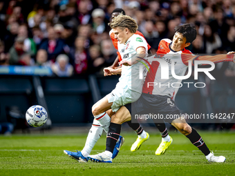 FC Twente midfielder Sem Steijn and Feyenoord Rotterdam midfielder Inbeom Hwang play during the match between Feyenoord and Twente at the Fe...