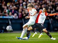 FC Twente midfielder Sem Steijn and Feyenoord Rotterdam midfielder Inbeom Hwang play during the match between Feyenoord and Twente at the Fe...