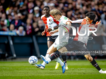 FC Twente midfielder Sem Steijn and Feyenoord Rotterdam midfielder Inbeom Hwang play during the match between Feyenoord and Twente at the Fe...