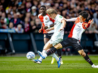 FC Twente midfielder Sem Steijn and Feyenoord Rotterdam midfielder Inbeom Hwang play during the match between Feyenoord and Twente at the Fe...