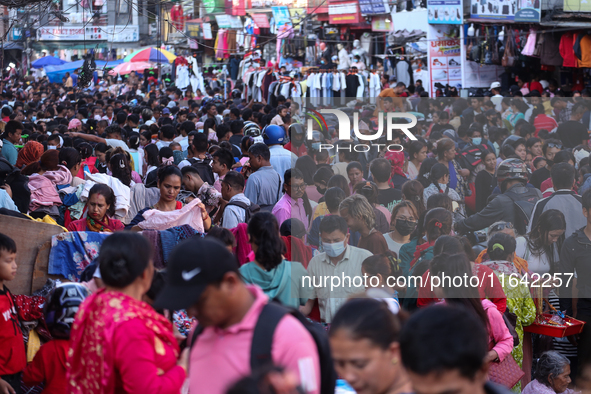 Nepalese customers visit the market to select gifts for family members for the upcoming Dashain festival in Laltipur, Nepal, on October 6, 2...