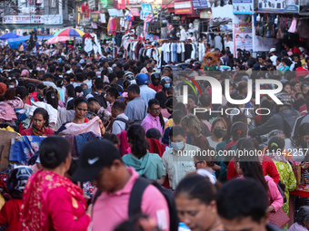 Nepalese customers visit the market to select gifts for family members for the upcoming Dashain festival in Laltipur, Nepal, on October 6, 2...