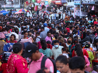 Nepalese customers visit the market to select gifts for family members for the upcoming Dashain festival in Laltipur, Nepal, on October 6, 2...