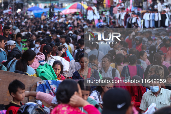 Nepalese customers visit the market to select gifts for family members for the upcoming Dashain festival in Laltipur, Nepal, on October 6, 2...