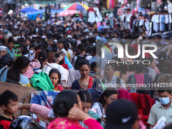 Nepalese customers visit the market to select gifts for family members for the upcoming Dashain festival in Laltipur, Nepal, on October 6, 2...