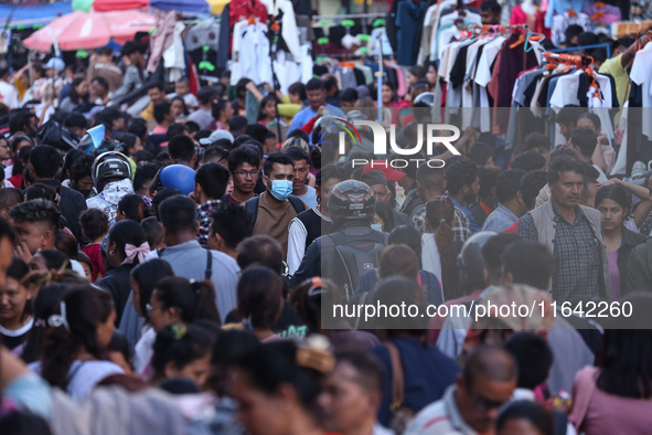 Nepalese customers visit the market to select gifts for family members for the upcoming Dashain festival in Laltipur, Nepal, on October 6, 2...