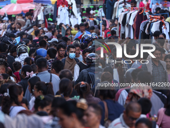 Nepalese customers visit the market to select gifts for family members for the upcoming Dashain festival in Laltipur, Nepal, on October 6, 2...