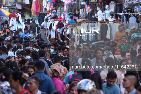 Nepalese customers visit the market to select gifts for family members for the upcoming Dashain festival in Laltipur, Nepal, on October 6, 2...