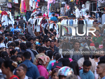 Nepalese customers visit the market to select gifts for family members for the upcoming Dashain festival in Laltipur, Nepal, on October 6, 2...