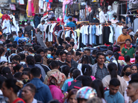 Nepalese customers visit the market to select gifts for family members for the upcoming Dashain festival in Laltipur, Nepal, on October 6, 2...