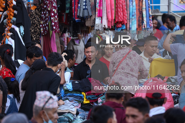 Nepalese customers visit the market to select gifts for family members for the upcoming Dashain festival in Laltipur, Nepal, on October 6, 2...