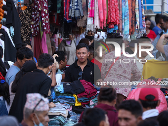 Nepalese customers visit the market to select gifts for family members for the upcoming Dashain festival in Laltipur, Nepal, on October 6, 2...