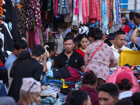 Nepalese customers visit the market to select gifts for family members for the upcoming Dashain festival in Laltipur, Nepal, on October 6, 2...