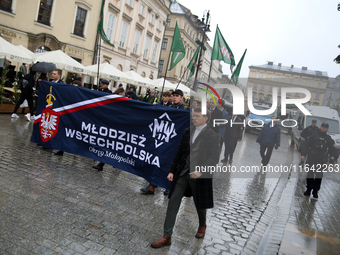 Participants of the All-Polish Youth March, a far-right ultranationalist organization, pass through the Main Square in Krakow, Poland, on Oc...