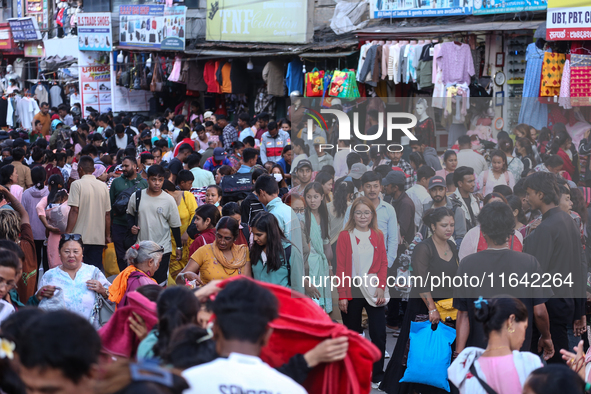 Nepalese customers visit the market to select gifts for family members for the upcoming Dashain festival in Laltipur, Nepal, on October 6, 2...