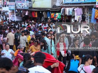 Nepalese customers visit the market to select gifts for family members for the upcoming Dashain festival in Laltipur, Nepal, on October 6, 2...