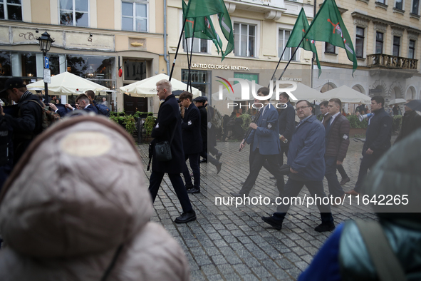 Participants of the All-Polish Youth March, a far-right ultranationalist organization, pass through the Main Square in Krakow, Poland, on Oc...