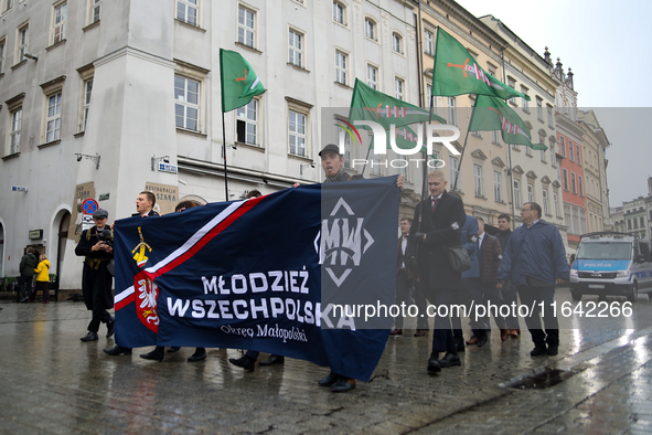 Participants of the All-Polish Youth March, a far-right ultranationalist organization, pass through the Main Square in Krakow, Poland, on Oc...