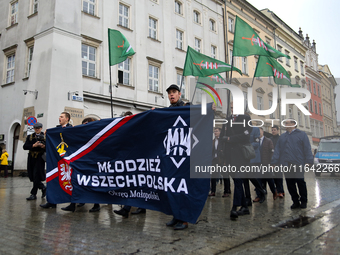 Participants of the All-Polish Youth March, a far-right ultranationalist organization, pass through the Main Square in Krakow, Poland, on Oc...