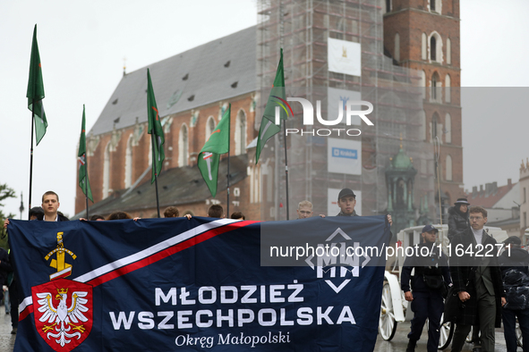 Participants of the All-Polish Youth March, a far-right ultranationalist organization, pass through the Main Square in Krakow, Poland, on Oc...