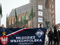 Participants of the All-Polish Youth March, a far-right ultranationalist organization, pass through the Main Square in Krakow, Poland, on Oc...