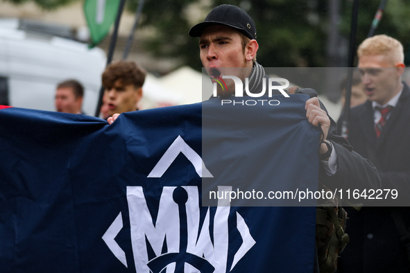 Participants of the All-Polish Youth March, a far-right ultranationalist organization, pass through the Main Square in Krakow, Poland, on Oc...