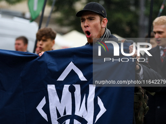 Participants of the All-Polish Youth March, a far-right ultranationalist organization, pass through the Main Square in Krakow, Poland, on Oc...