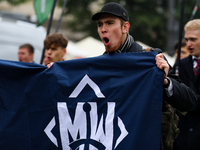 Participants of the All-Polish Youth March, a far-right ultranationalist organization, pass through the Main Square in Krakow, Poland, on Oc...