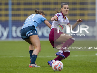 Seraina Piubel #77 of West Ham United F.C. is tackled by Kerstin Casparij #18 of Manchester City W.F.C. during the Barclays FA Women's Super...