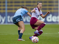 Seraina Piubel #77 of West Ham United F.C. is tackled by Kerstin Casparij #18 of Manchester City W.F.C. during the Barclays FA Women's Super...