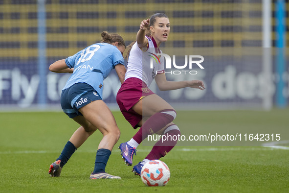 Seraina Piubel #77 of West Ham United F.C. is tackled by Kerstin Casparij #18 of Manchester City W.F.C. during the Barclays FA Women's Super...