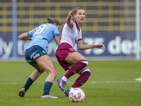 Seraina Piubel #77 of West Ham United F.C. is tackled by Kerstin Casparij #18 of Manchester City W.F.C. during the Barclays FA Women's Super...