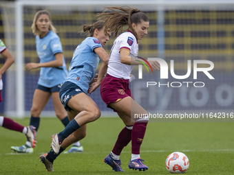 Seraina Piubel #77 of West Ham United F.C. is tackled by Kerstin Casparij #18 of Manchester City W.F.C. during the Barclays FA Women's Super...