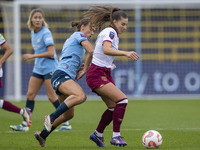 Seraina Piubel #77 of West Ham United F.C. is tackled by Kerstin Casparij #18 of Manchester City W.F.C. during the Barclays FA Women's Super...