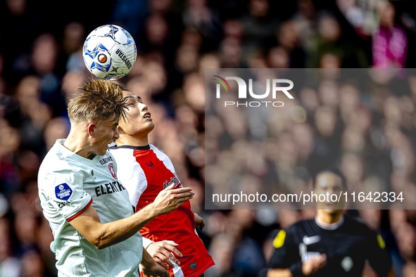 FC Twente midfielder Sem Steijn and Feyenoord Rotterdam forward Ayase Ueda play during the match between Feyenoord and Twente at the Feyenoo...