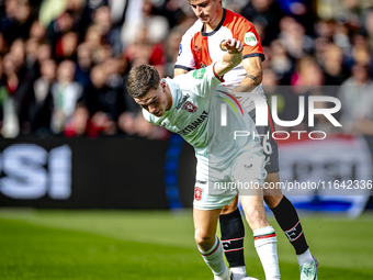 FC Twente forward Daan Rots and Feyenoord Rotterdam defender Hugo Bueno play during the match between Feyenoord and Twente at the Feyenoord...