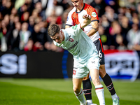 FC Twente forward Daan Rots and Feyenoord Rotterdam defender Hugo Bueno play during the match between Feyenoord and Twente at the Feyenoord...