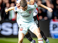 FC Twente forward Daan Rots and Feyenoord Rotterdam defender Hugo Bueno play during the match between Feyenoord and Twente at the Feyenoord...