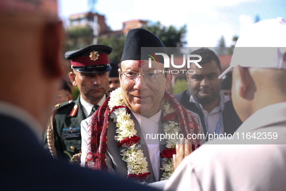 Nepal's newly appointed Chief Justice Prakashman Singh Raut is welcomed by Supreme Court officials after taking the oath of secrecy in Kathm...