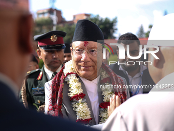 Nepal's newly appointed Chief Justice Prakashman Singh Raut is welcomed by Supreme Court officials after taking the oath of secrecy in Kathm...